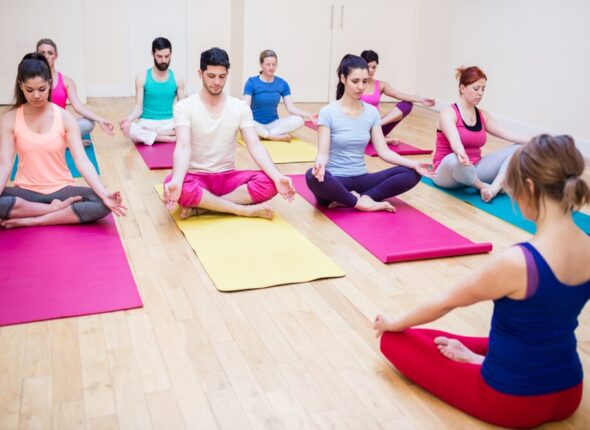 group-people-trainer-sitting-lotus-position_1170-2883